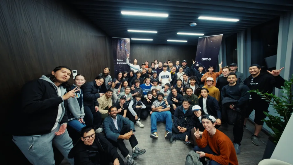 Attendees gathering for a group photo at Astra Commons in Astana